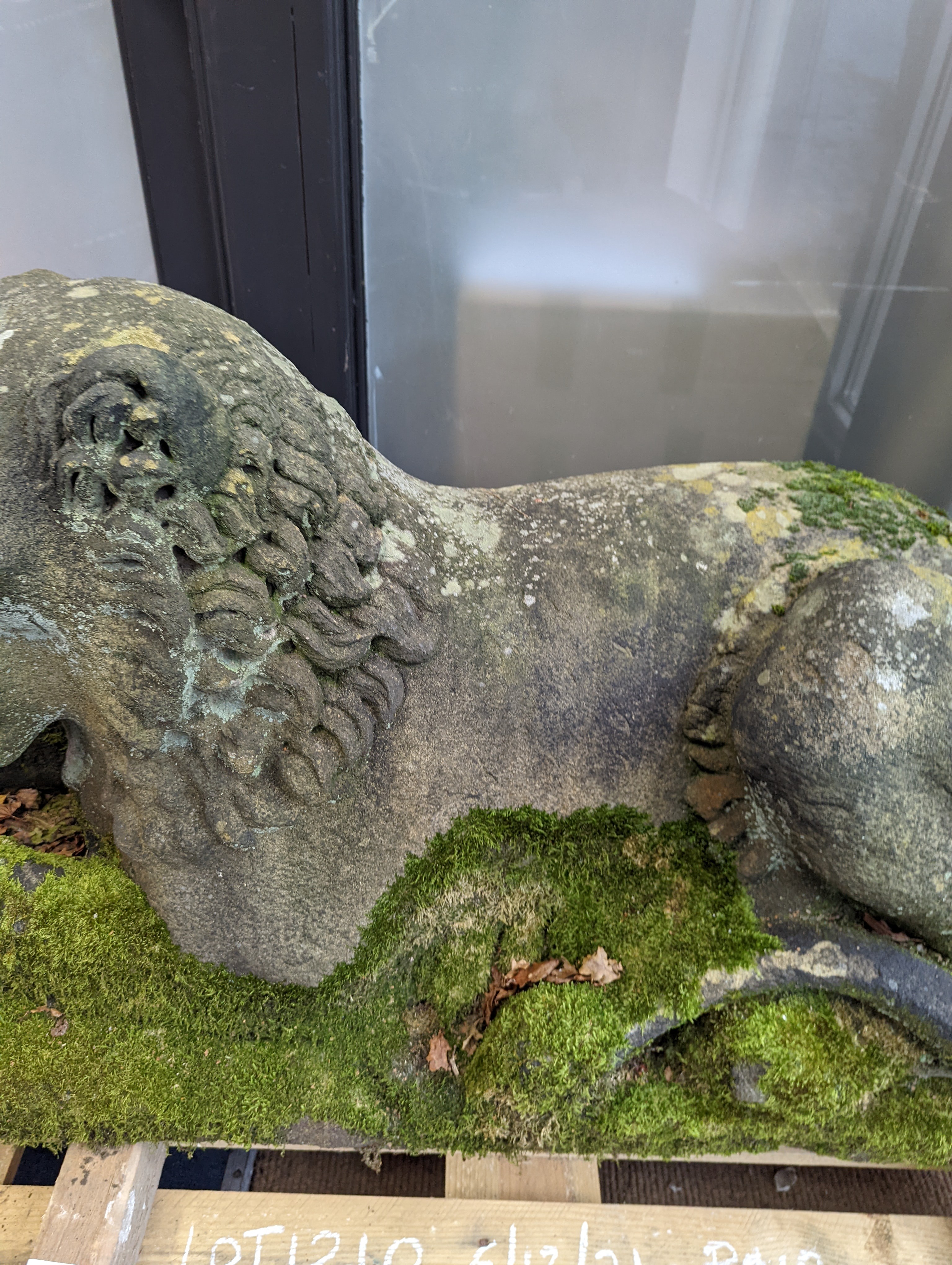 A pair of carved stone models of a recumbent lion and lioness, purchased from Crowther of Syon Lodge approximately 40 years ago. Length 122cm. Width 50cm. Height 60cm.